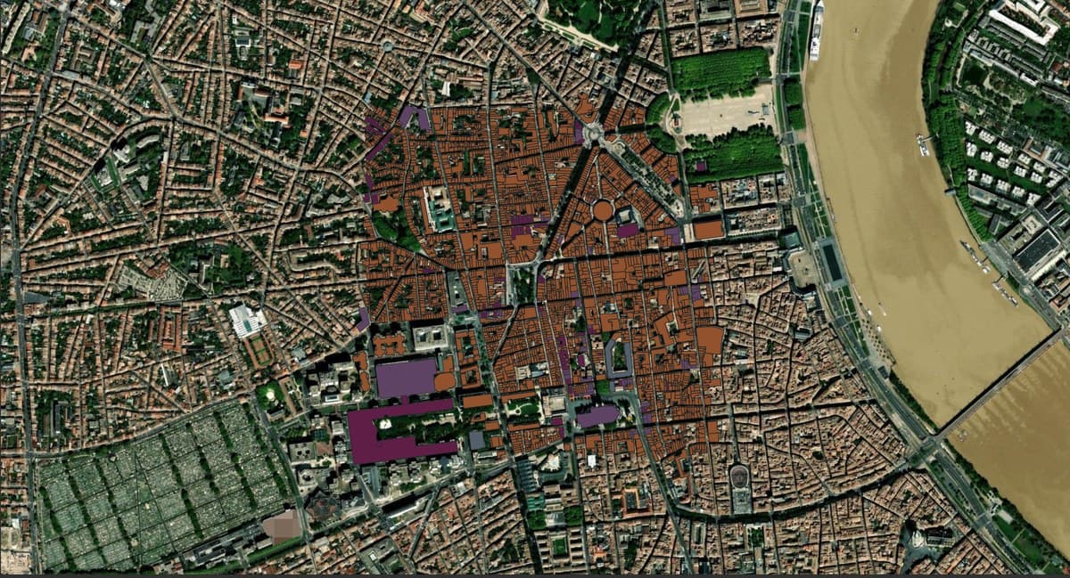 Building footprints coloured by height over satellite imagery of Bordeaux