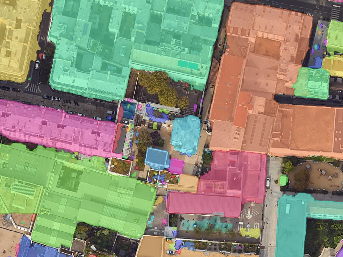 Close view of Haussmann blocks, each block one coloured polygon following the street edge with courtyards cut out