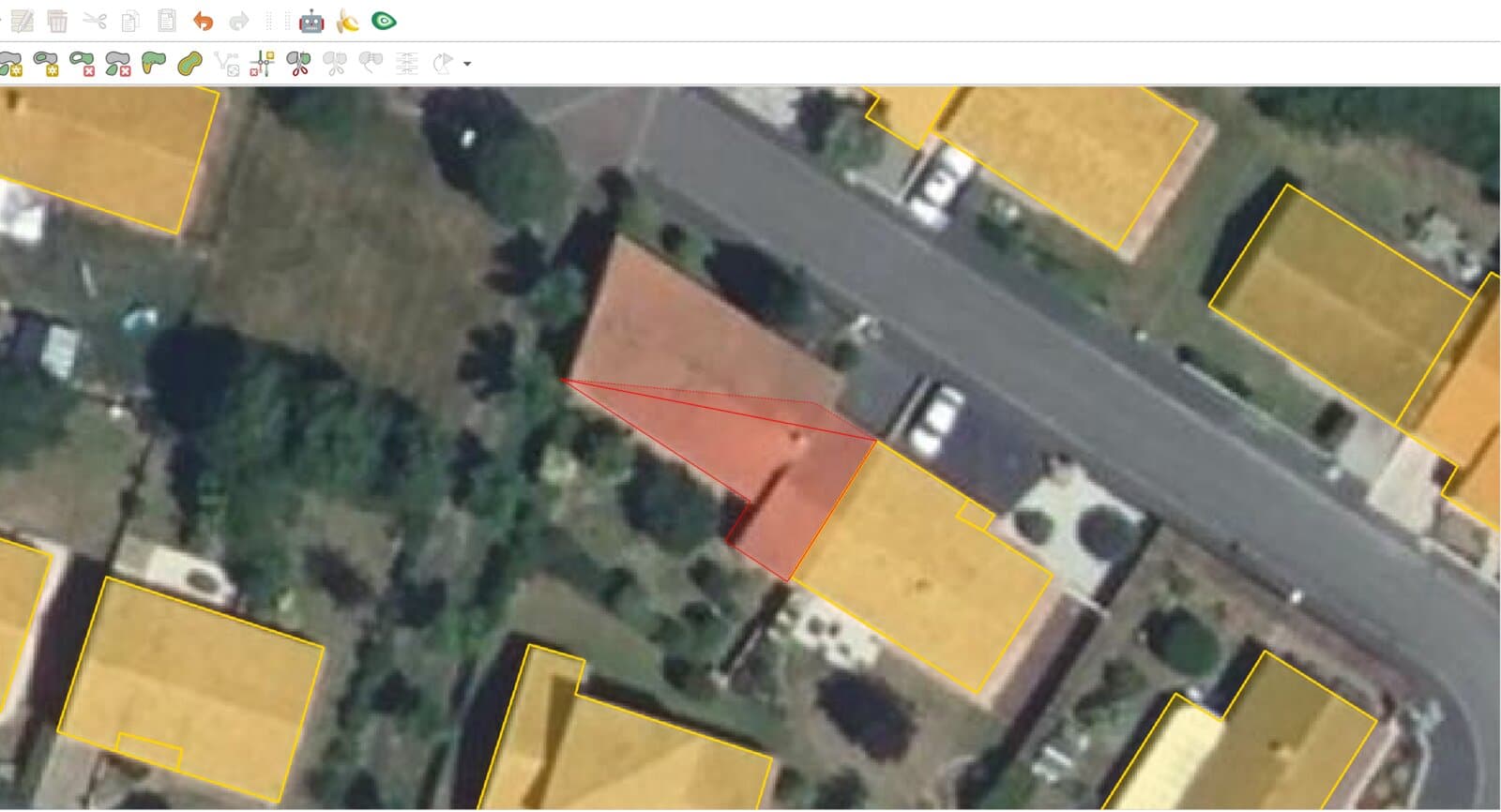QGIS with the digitizing toolbars open over an aerial photo of houses. A red polygon is half drawn over one roof, while the neighbouring houses carry yellow outlines that sit slightly off their roofs.