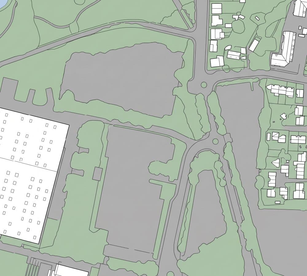 An aerial view redrawn as a flat site plan, with white building footprints outlined in black, mid grey roads and parking, and pale sage green vegetation.