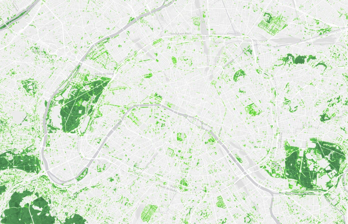 Copernicus Tree Cover Density loaded in QGIS over Paris, shaded from pale to dark green by percentage of tree cover, with the two woods on either side of the city solid dark green.