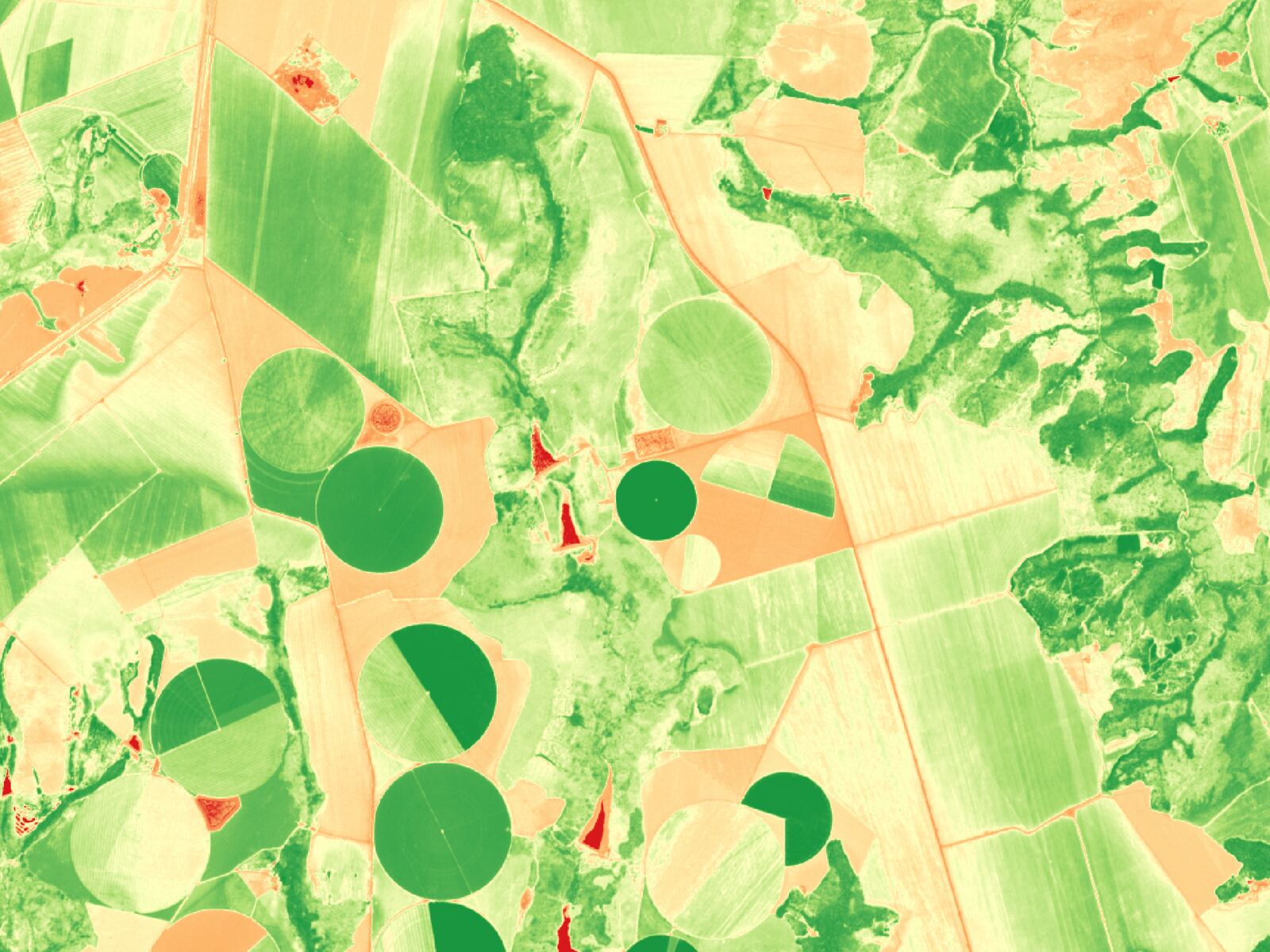 Centre pivots near Cristalina in Sentinel-2 true colour, then the same view as NDVI from red to green (after)