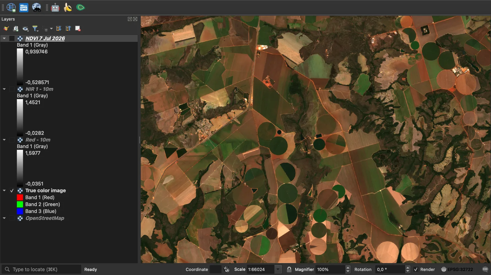 QGIS with the Sentinel-2 true colour image of 7 July 2026 over the Cristalina pivots, and the Layers panel listing the true colour, red, NIR and NDVI layers, the red band legend reading -0.0351 to 1.5977.