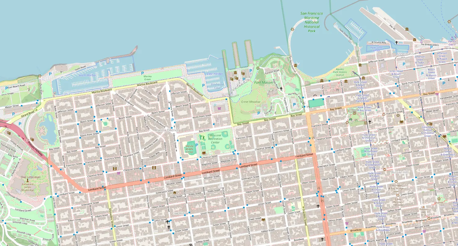 OpenStreetMap of the Marina District and Fort Mason in San Francisco, then the same view with the georeferenced 1947 USGS map at 55 percent opacity, Lombard Street and the shoreline lining up (before)