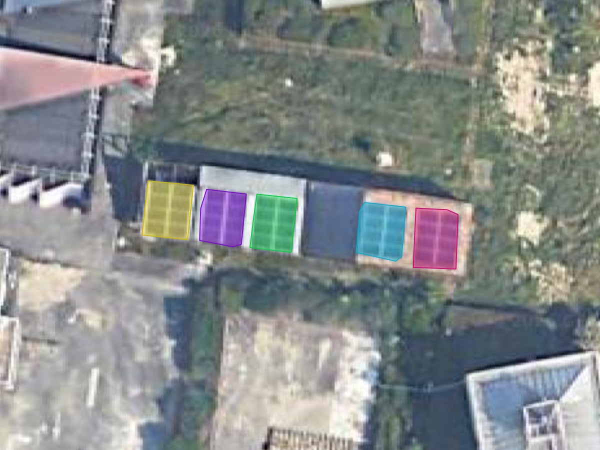 Close view of a roof where five solar panel arrays are outlined separately