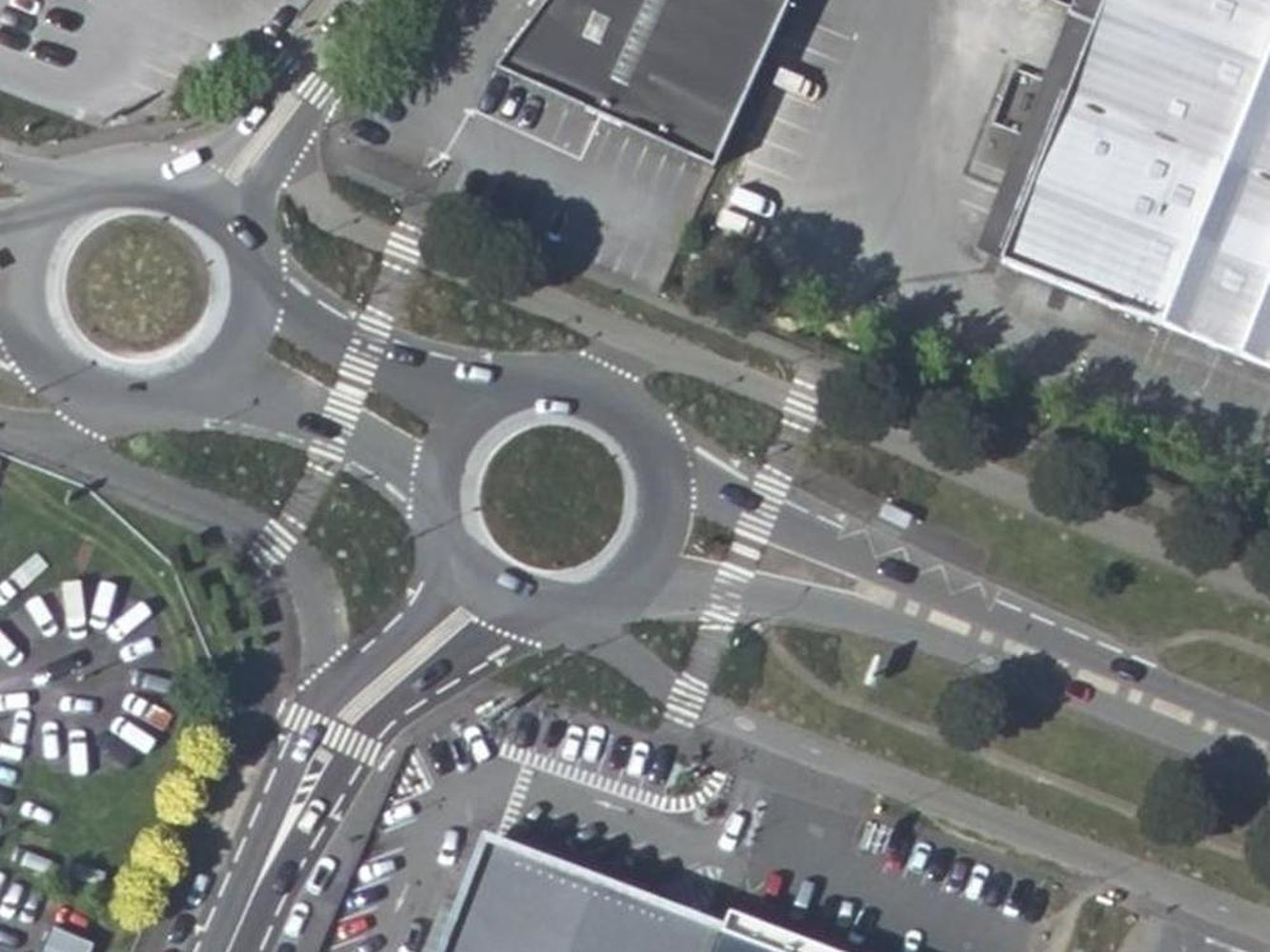 The two roundabouts before, then the same junction with smaller circulating lanes, short straight crossings and grass replacing the surplus asphalt (before)